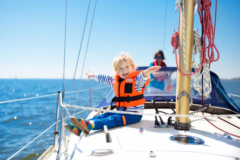 Photo of a Happy Young Boy Sailing On One of the Best Myrtle Beach Boat Tours.